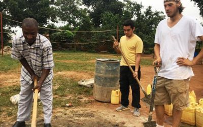 Improving Family Development in Uganda: An update volunteers helping with school construction