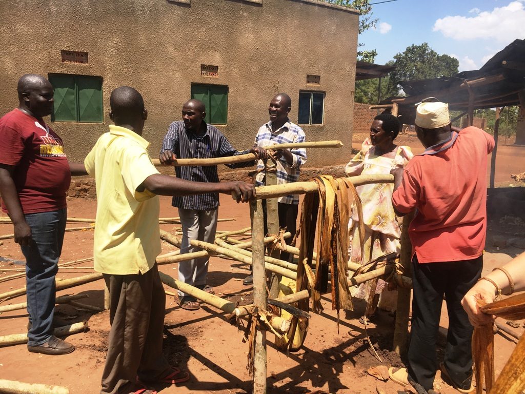Ugandans working together to improve community hygeine and sanitation