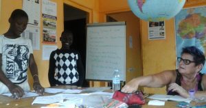 Volunteer working with Ugandan school children