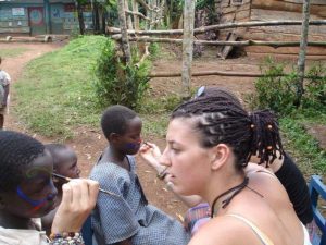 volunteer in Uganda working at a primary school
