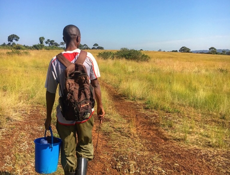 Uganda farmer on his way to the garden