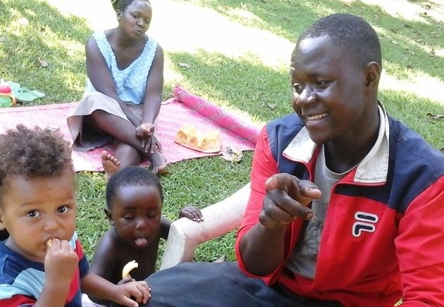 Ugandan family eating jackfruit