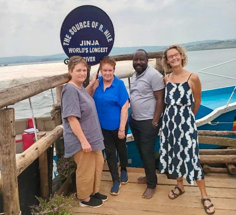 4 tourists at the source of the River Nile in Uganda